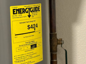 energy guide tag on water heater telling you it's age