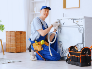 Plumber disconnecting washing machine drain line