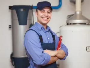 Professional plumber standing by water heater system ready for installation services